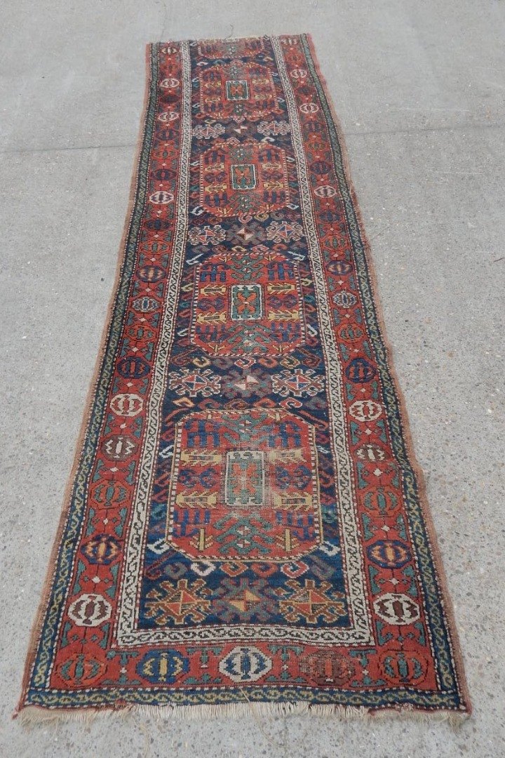 Appraisal: A Persian runner in Kazak style with a design of