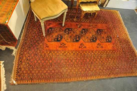 Appraisal: A PERSIAN RUG IN RED AND BROWN TONES