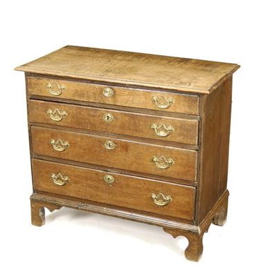 Appraisal: An early George III oak chest the moulded edge top