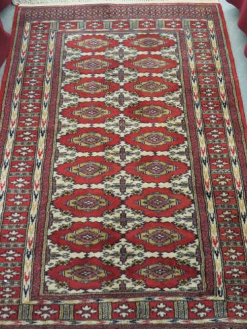 Appraisal: Bokara Pakistan Handmade Rug geometrics on red field ' x