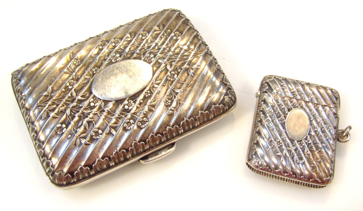 Appraisal: An Edwardian silver vesta case and matched silver gilt cigarette