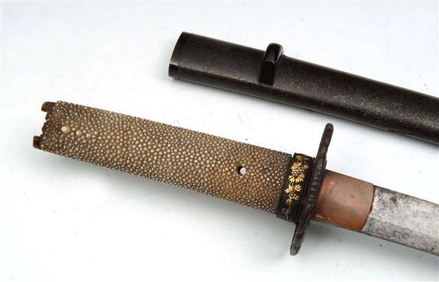 Appraisal: A JAPANESE WAKASASHI with iron tsuba shagreen handle and with