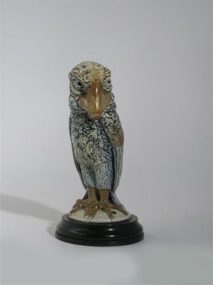 Appraisal: A Martin Brothers stoneware bird jar and cover modelled with