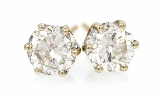 Appraisal: A Pair of Yellow Gold and Diamond Stud Earrings containing