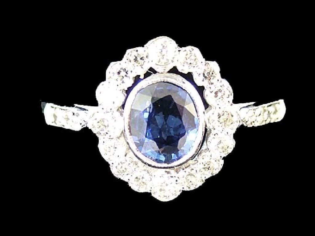 Appraisal: ct white gold sapphire and diamond oval cluster ring ct