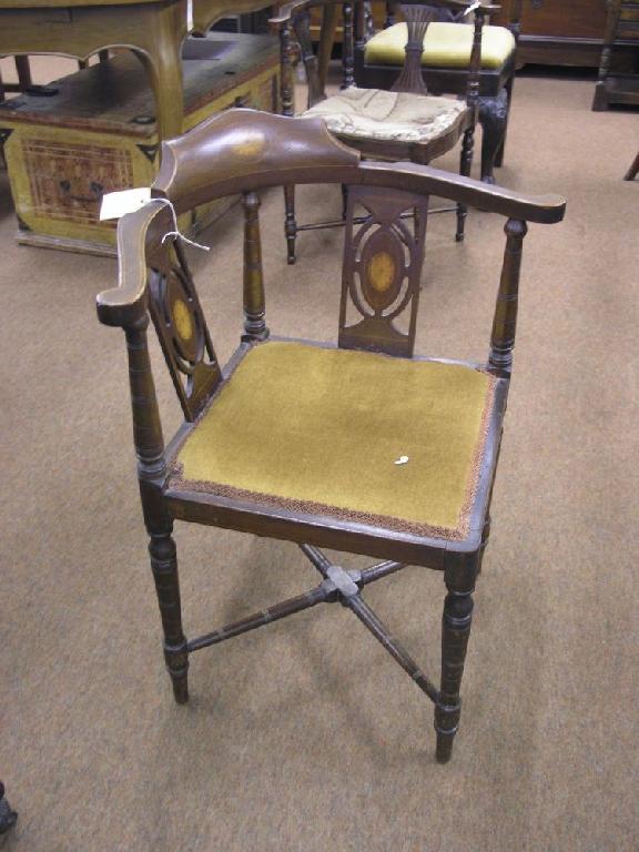 Appraisal: An Edwardian inlaid mahogany corner fitting elbow chair cresting rail