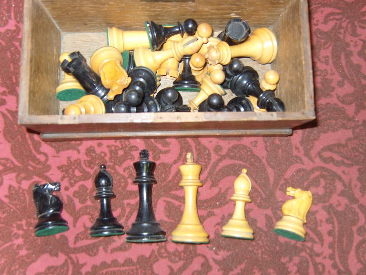 Appraisal: An oak box containing a set of turned wooden chess