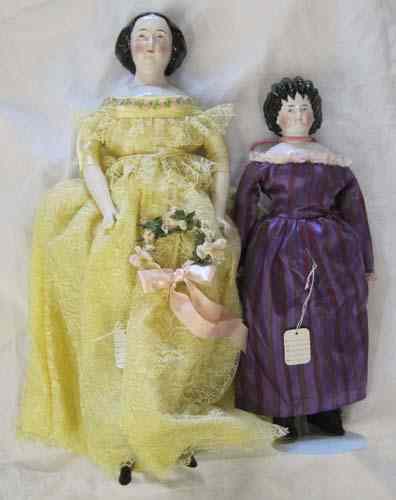 Appraisal: TWO CHINA SHOULDER-HEAD DOLLS each with black painted hair The