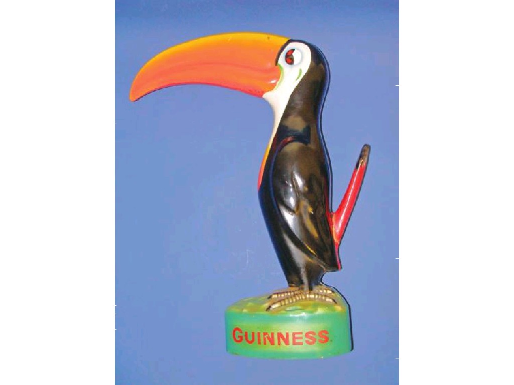 Appraisal: A LARGE GUINNESS ADVERTISING TOUCAN with large orange beak on