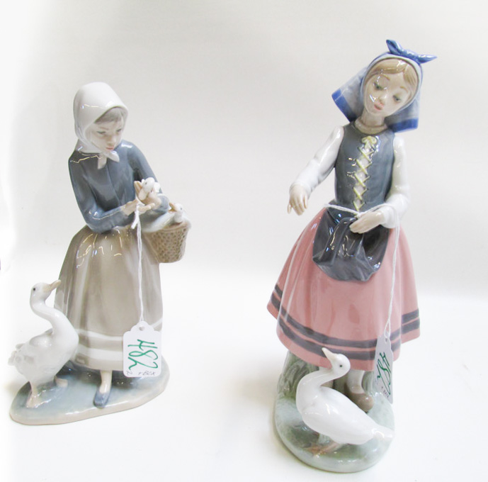 Appraisal: TWO LLADRO PORCELAIN FIGURINES Shepherdess with Ducks by sculptor Fulgencio