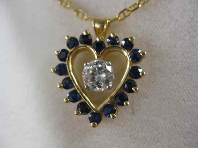 Appraisal: Diamond Sapphire Pendant high grade carat round diamond surrounded by