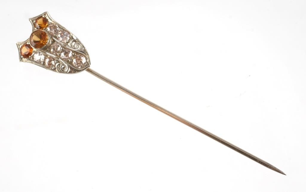 Appraisal: k white gold tested shield-shaped stick pin with three orange