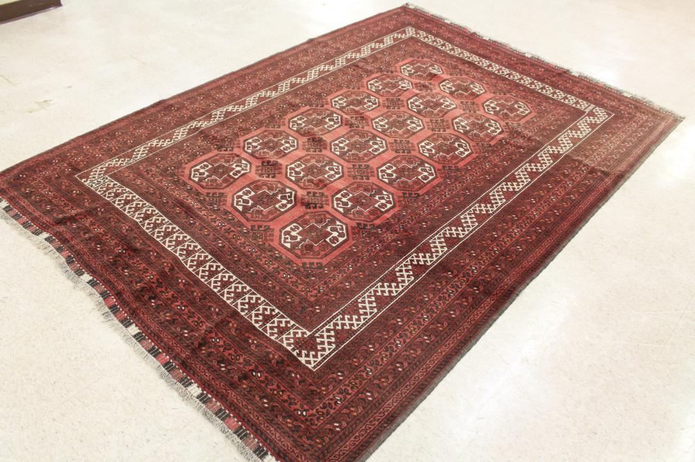 Appraisal: HAND KNOTTED AFGHAN BELOUCHI TURKMAN CARPET repeating geometric medallion design