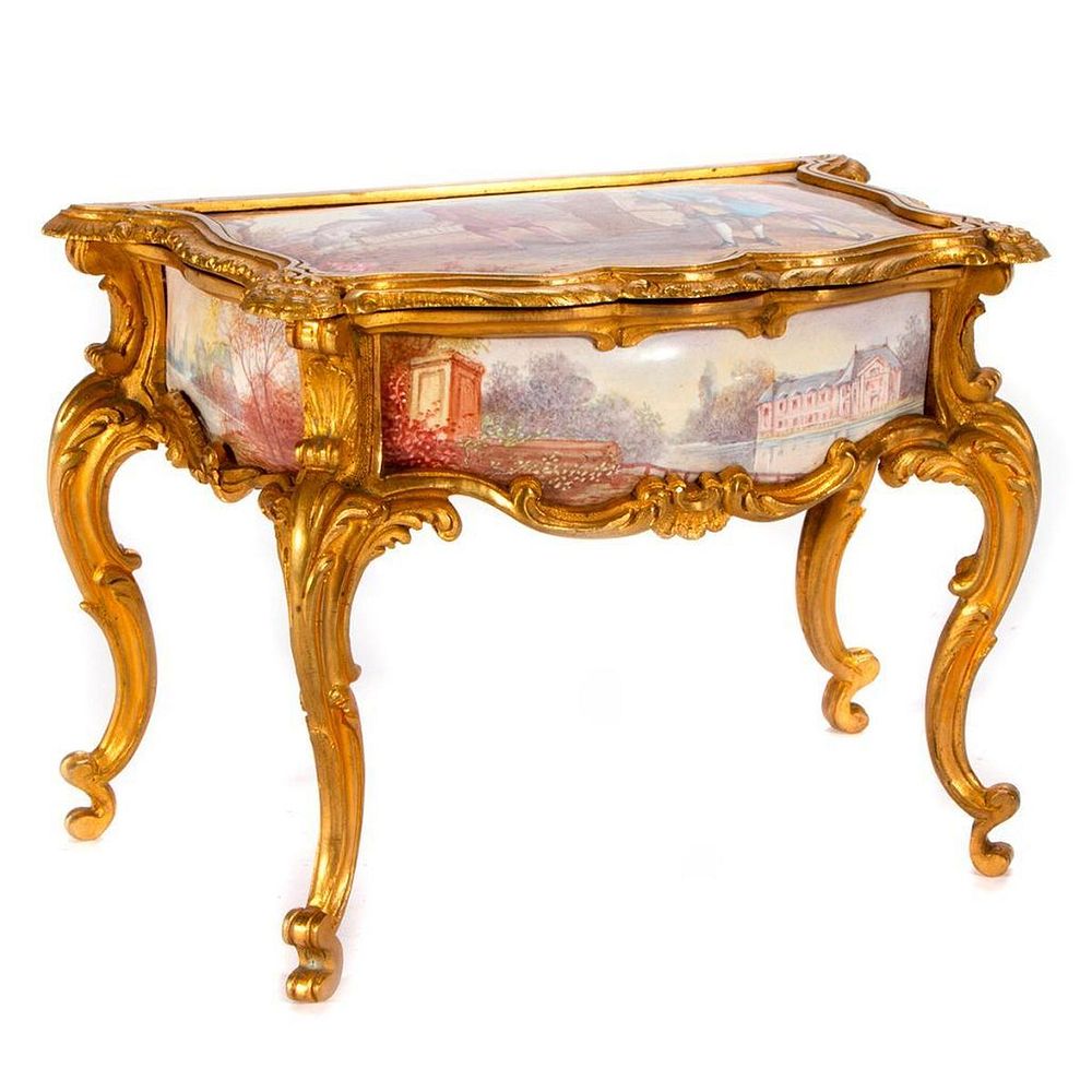 Appraisal: A gilt metal and porcelain jewelry box A Continental gilt