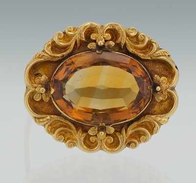 Appraisal: A Victorian Citrine Gold Brooch Fine scroll work frame set