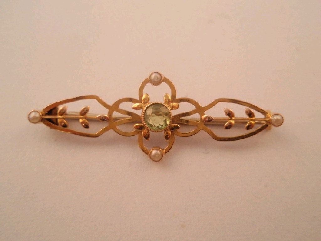 Appraisal: A seed pearl and central peridot set brooch in yellow