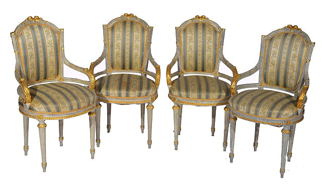 Appraisal: A SET OF TWELVE FRENCH PAINTED AND GILDED ARMCHAIRS with