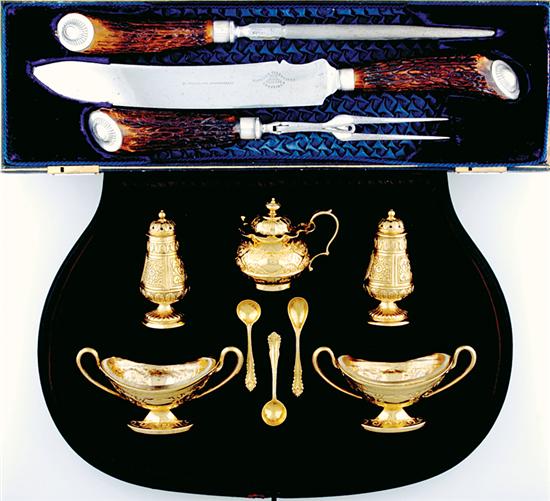 Appraisal: Victorian gilt-silver cased condiment set and carving set London dated