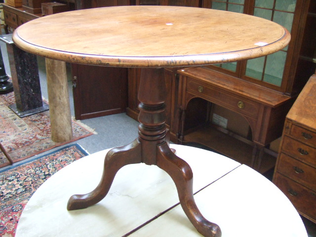 Appraisal: A mid th century mahogany occasional table the circular top