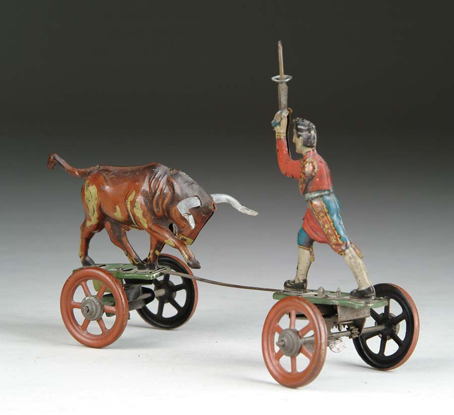 Appraisal: MATADOR AND BULL SPRING TOY A comical toy depicting a