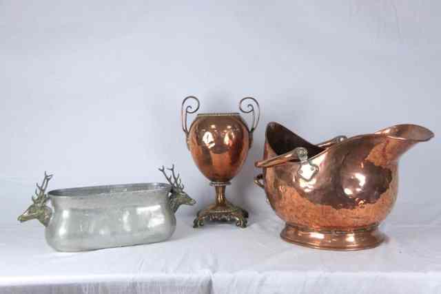 Appraisal: A copper two-handled urn circa on a leaf base cm