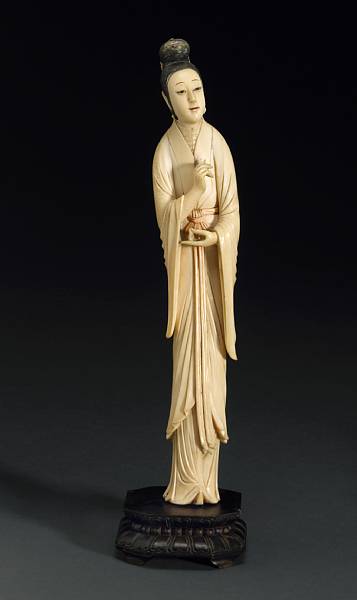 Appraisal: A tinted ivory figure of a beauty th Century The