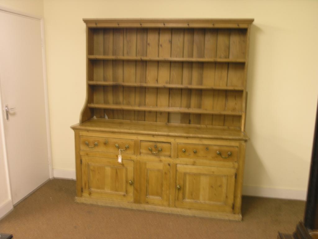 Appraisal: A late Victorian waxed pine dresser with three-shelf plate rack