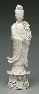 Appraisal: Porcelain figure of Guanyin standing on a lotus throne holding