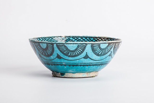 Appraisal: A PERSIAN KASHAN TURQUOISE GLAZE CIRCULAR BOWL with black painted