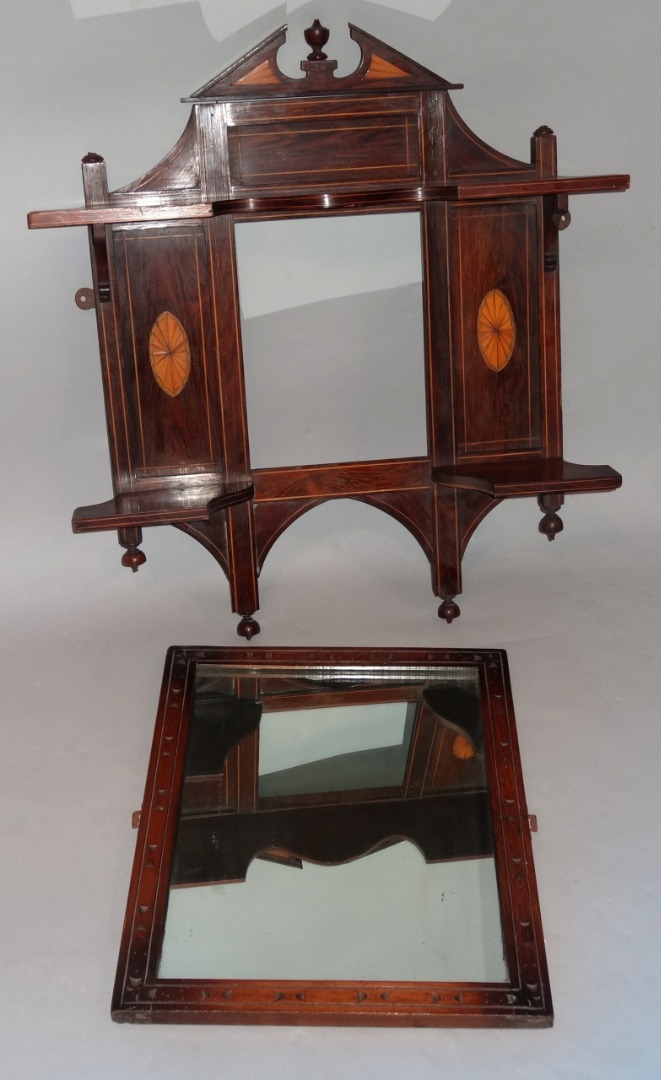 Appraisal: An Edwardian rosewood mirror frame with shell inlay and a