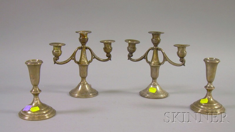 Appraisal: Two Pairs of Weighted Sterling Candlesticks Empire low candlesticks and