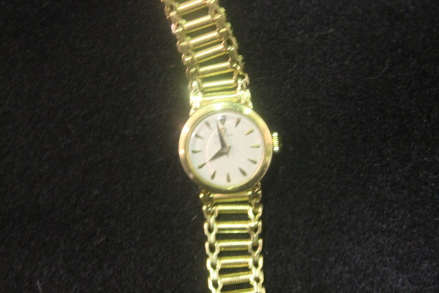 Appraisal: AN K GOLD OMEGA LADIES WRISTWATCH with integral k gold