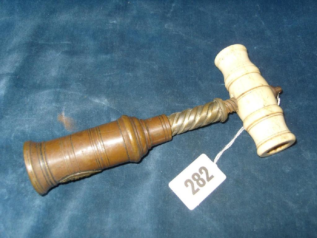 Appraisal: A Georgian patent corkscrew with turned ivory handle by Heeley