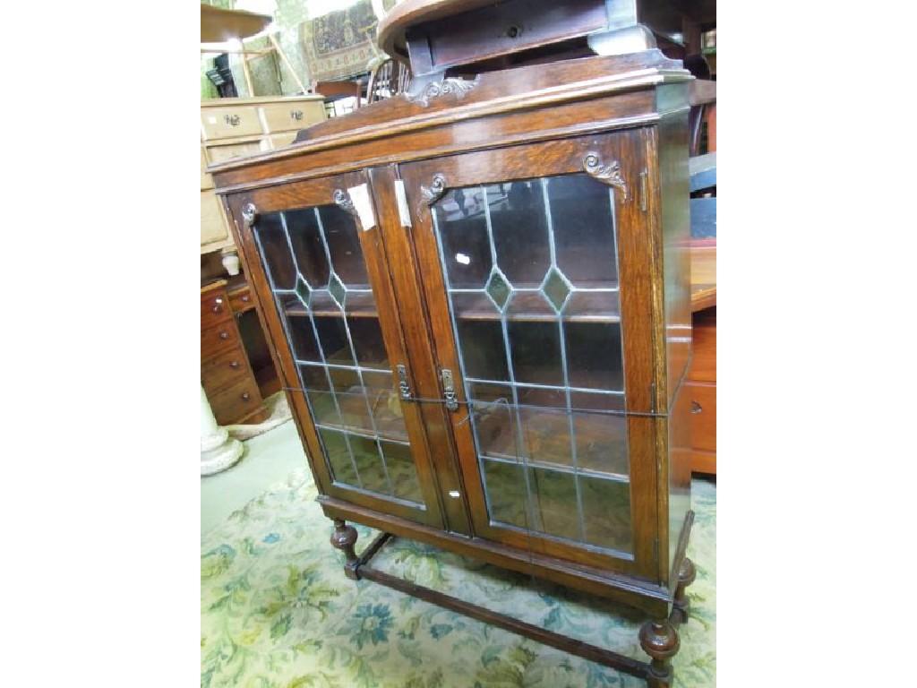 Appraisal: An Edwardian 's freestanding bookcase enclosed by a pair of