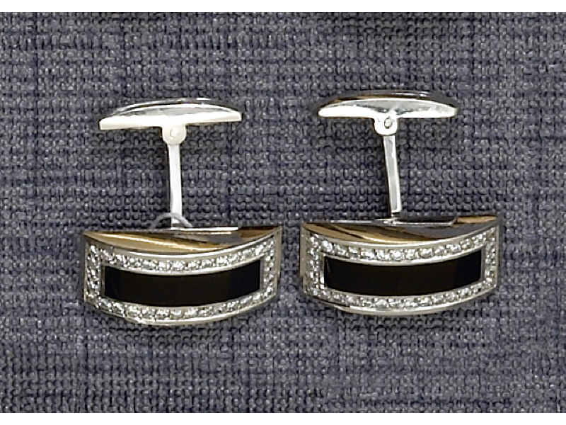 Appraisal: CUFF LINKS k white gold with inset curved black onyx