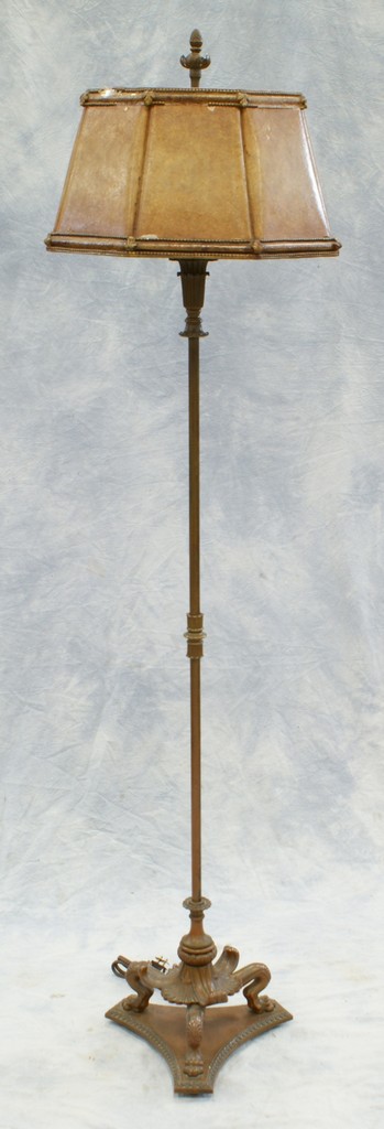 Appraisal: Bronze floor lamp with original celluloid shade base with animal