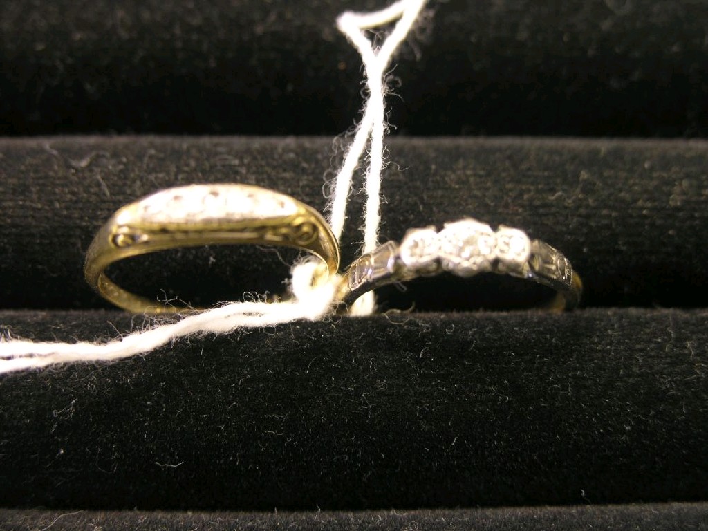 Appraisal: Two ct gold three-stone diamond rings one in platinum claw