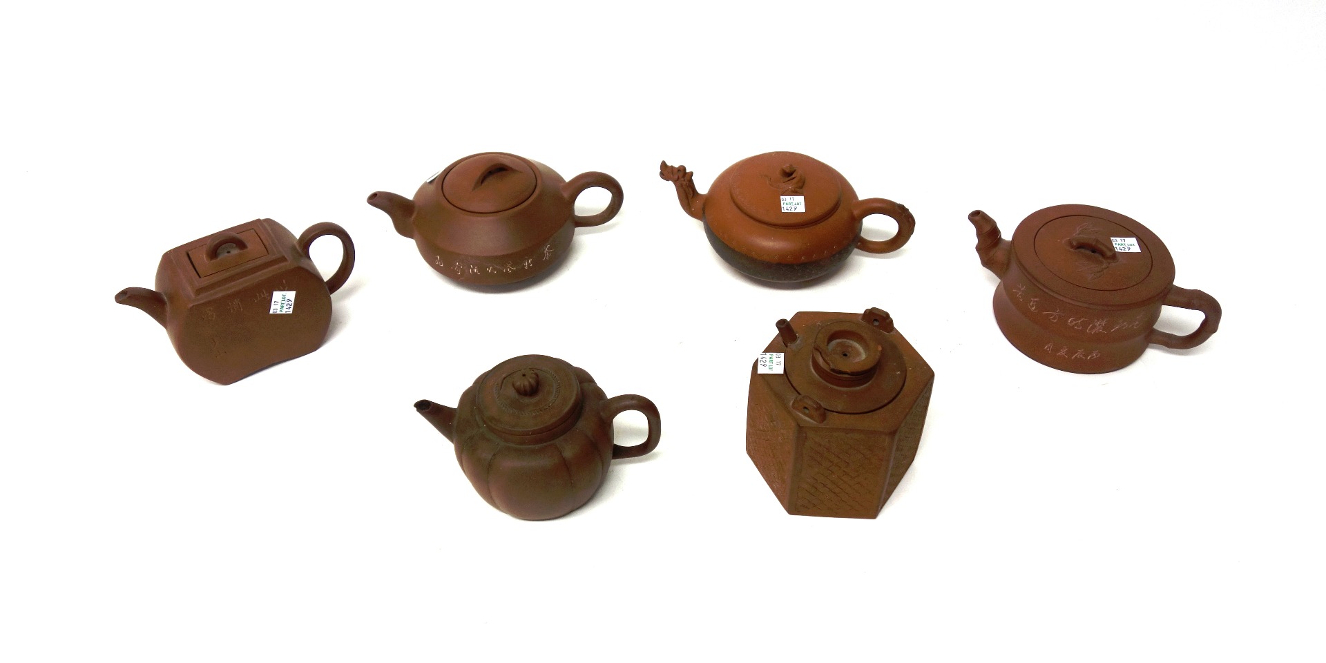 Appraisal: A group of six Chinese Yixing teapots and covers th