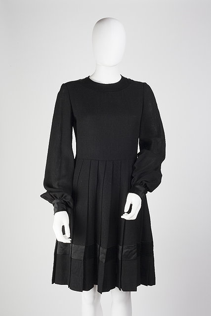 Appraisal: A black dress with pleated skirt with full length sleeves