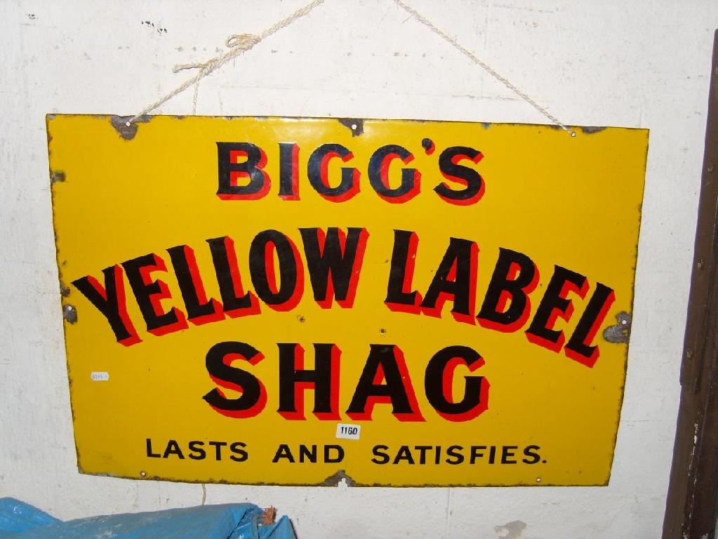 Appraisal: A yellow enamelled sign for Biggs Yellow Label Shag