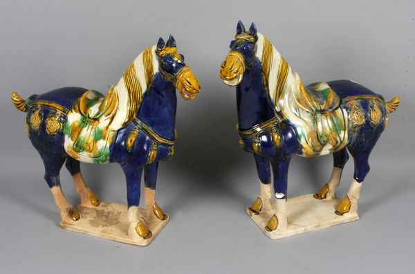 Appraisal: Pair of Chinese Tang style horsesPair of Chinese Tang style