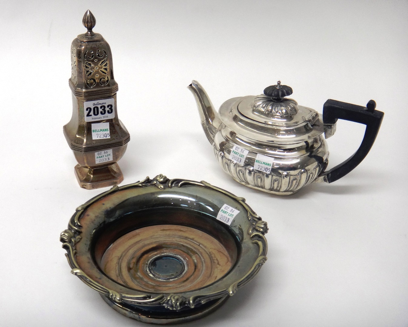 Appraisal: A silver teapot of squat oval form with partly fluted