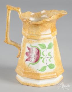 Appraisal: Yellow spatter pitcher with tulip decoration '' h