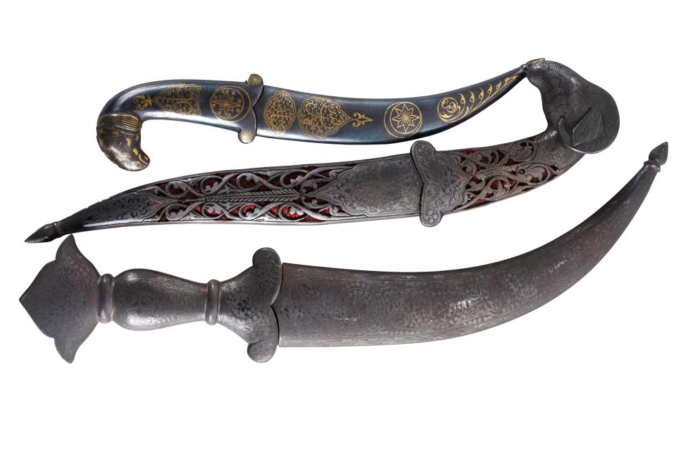 Appraisal: THREE INDO-PERSIAN DAGGERScomprising one with gilt damascene sheath and handle