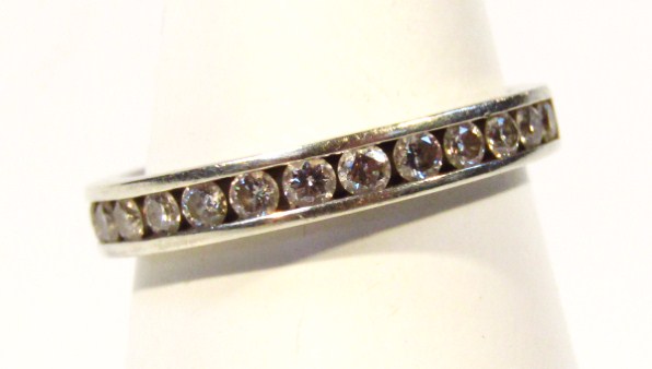 Appraisal: A half eternity ring set with sixteen small diamonds white