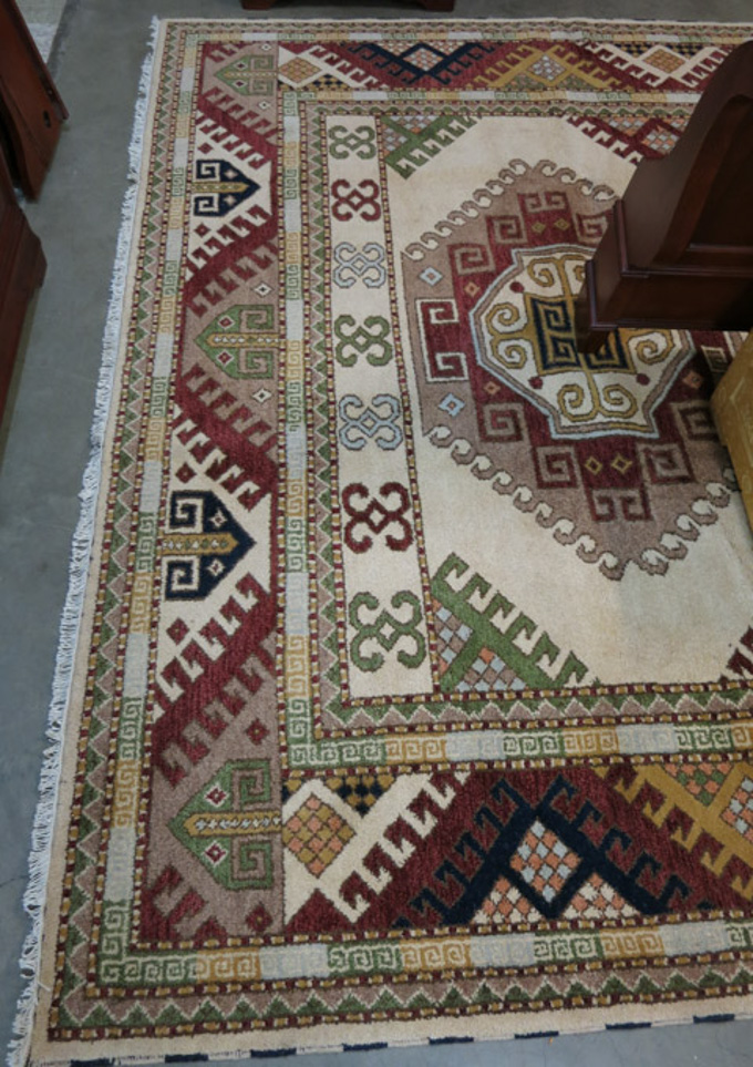 Appraisal: HAND KNOTTED ORIENTAL CARPET Indo-Kazak featuring three large hexagonal latch-hook