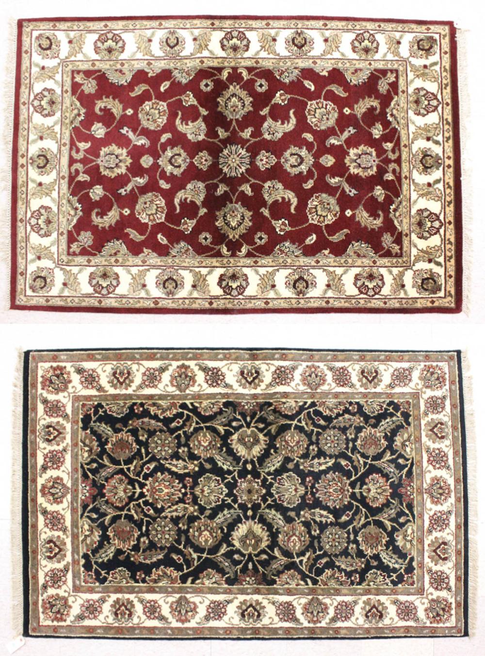 Appraisal: TWO HAND KNOTTED ORIENTAL AREA RUGS Indo-Persian similar overall floral