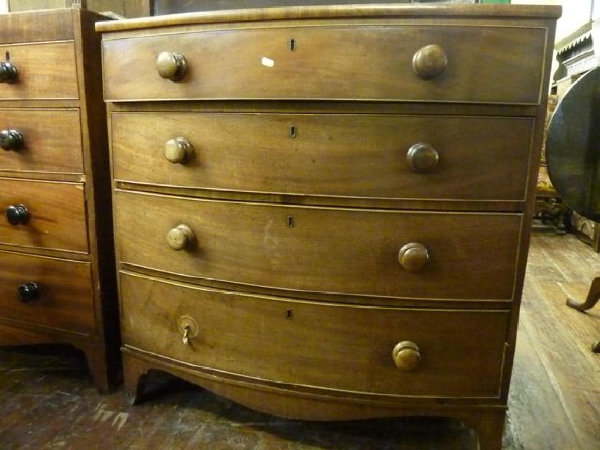 Appraisal: A Regency mahogany bow front chest fitted with four long