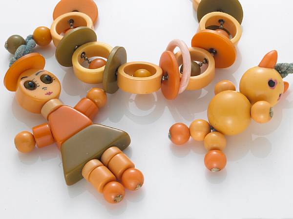 Appraisal: A collection of three bakelite crib toys