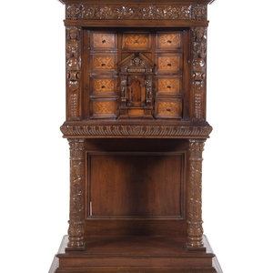 Appraisal: A Renaissance Revival Carved Walnut and Marquetry Collector's Cabinet th